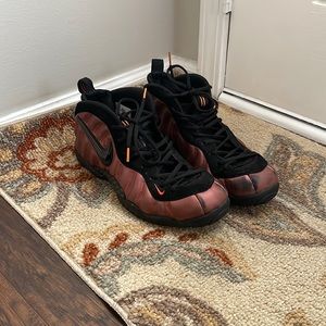 Size 12 nike foamposite has some scuffs recently cleaned crimson red colorway.